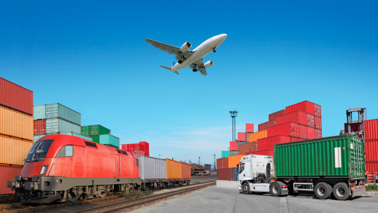 Cargo train, truck with cargo container and flying airplane, photomontage. See my other similar photos: :  http://www.oc-photo.net/FTP/icons/cargo.jpg